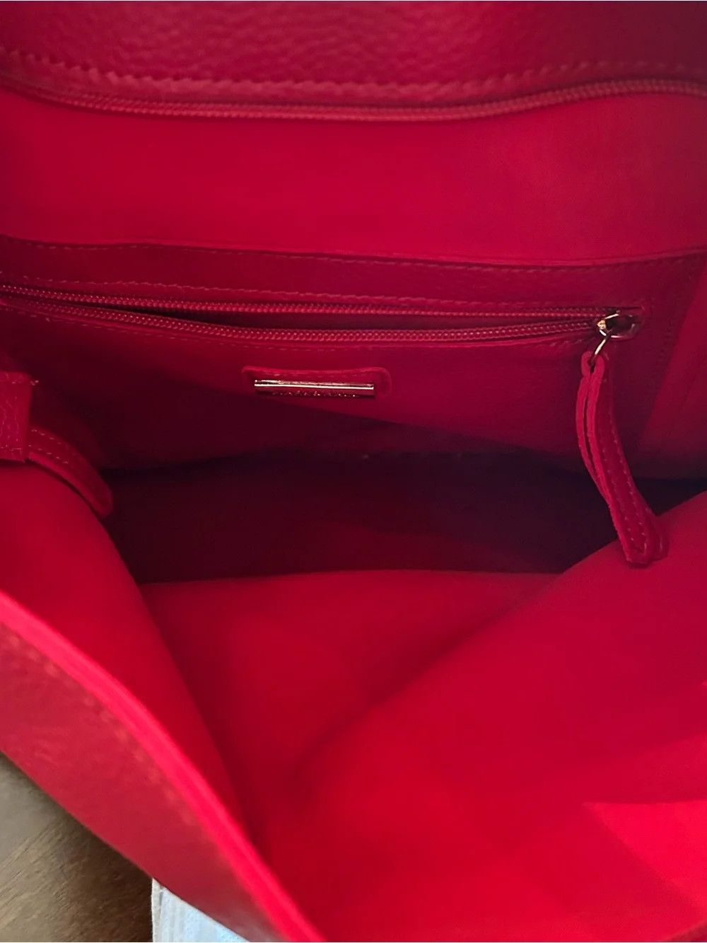 Mark & Hall shoulder Red pebbled Hobo Bag with Braided Trim and red tassel.